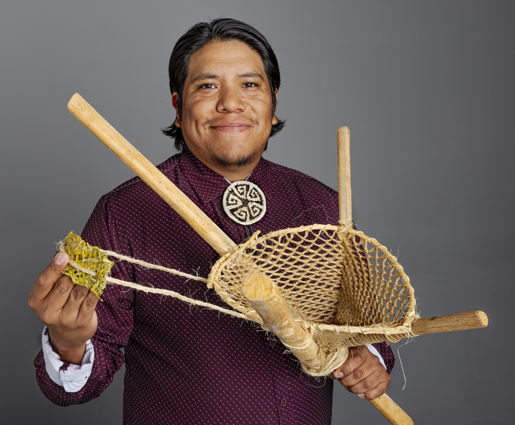 Bryce Antone, young O'odham man with a burden basket